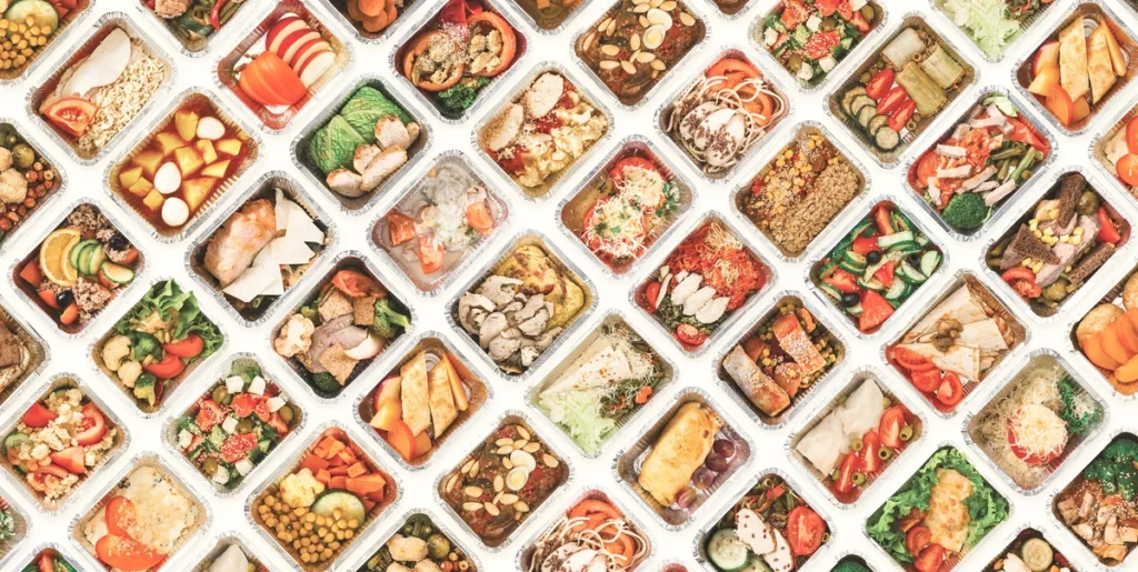 Large family dinner spread overflowing with homemade dishes and sides.